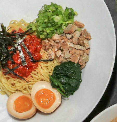 Spicy Mazesoba, a dry noodle bowl with chashu, egg and spinach