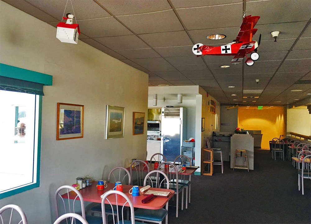 The cafe dining room with model planes hanging from the ceiling